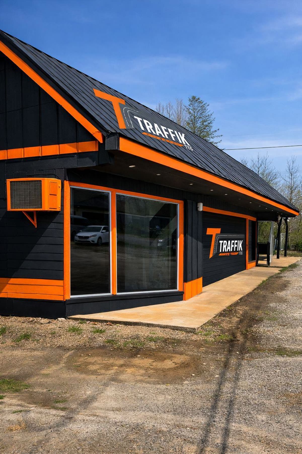 Traffik TTC branch building in black and safety orange, with the company sign on the roof